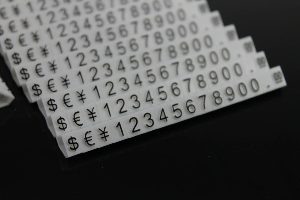 Plastové cenovky černé, bílé 6x9mm 20x řada €,$,¥