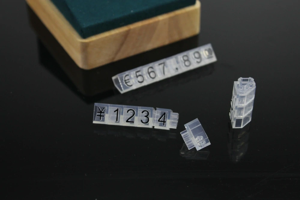 Plastové cenovky černé, průhledné 6x9mm 20x řada €,$,¥