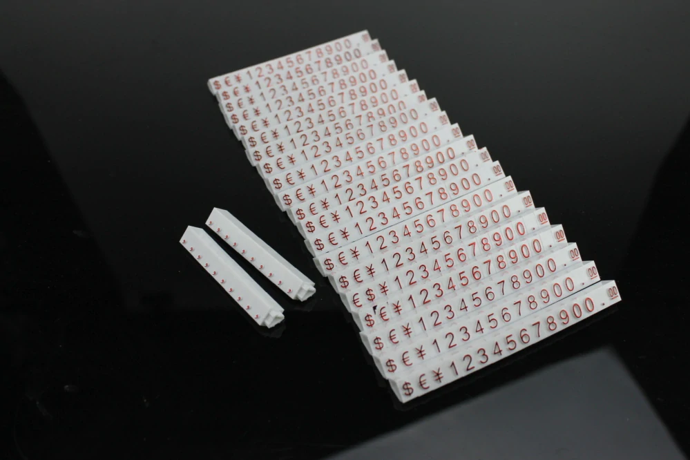 Plastové cenovky červené, bílé 6x9mm 20x řada €,$,¥